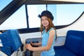 Kid girl pretending be a captain sailor cap in boat Royalty Free Stock Photo