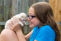 Kid girl with puppy pet chihuahua playing happy