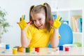 Kid girl showing painted hands Royalty Free Stock Photo
