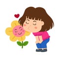 Kid girl smelling flower