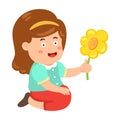 Kid girl smelling flower
