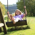 Kid - girl on swing Royalty Free Stock Photo