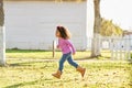 Kid girl toddler playing running in park outdoor Royalty Free Stock Photo
