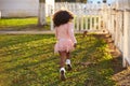 Kid girl toddler playing running in park rear view Royalty Free Stock Photo