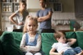Kid girl upset, offended or bored ignoring parents and brother Royalty Free Stock Photo