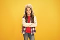 Kid girl wear hat with ear flaps. Winter events at school. Winter entertainment and activities. Child carefree