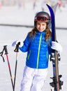 Kid girl winter snow with ski equipment Royalty Free Stock Photo