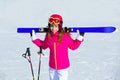 Kid girl winter snow with ski equipment Royalty Free Stock Photo