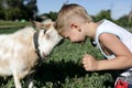 Kid and goat head butting Royalty Free Stock Photo