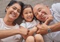 Kid, grandma and grandpa lying on floor playing at home, spending family time together above view. Happy grandparents Royalty Free Stock Photo