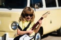 Kid with guitar. Portrait of 7 years old boy outdoor. Royalty Free Stock Photo