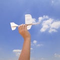 Hand holding a model airplane Royalty Free Stock Photo