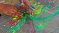 Little kid with color festival Holi. Organic herbal color for celebration Dhulandi or Rangpanchmi festival. Holi concept