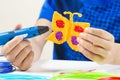 Kid hands creating with blue 3d pen
