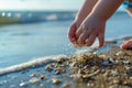 Kid hands holding micro plastics. Little child collects plastic from beach sand. Environment, pollution, plastic waste Royalty Free Stock Photo