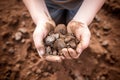 Kid hands holding poor soil, poor soil quality agricultural and environmental crisis. generative ai