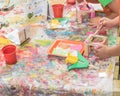 Kid hands painting craft at building workshop in local hardware store in Texas, USA
