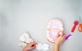 Kid hands play on doh clay in dentist ,teeth and tools on floor