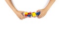 Kid hands playing with toy train on white table background. Top view Royalty Free Stock Photo