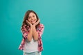 Kid happy cute face with adorable curly hair stand over blue background. Pure beauty. Beauty tips for tidy hair. Kid Royalty Free Stock Photo