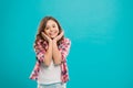 Kid happy cute face with adorable curly hair stand over blue background. Pure beauty. Beauty tips for tidy hair. Kid