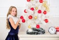 Kid happy because holiday season arrives. Winter holiday concept. Family holiday concept. Girl velvet dress feel festive Royalty Free Stock Photo