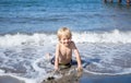 Kid Has Fun On Hot Summer Day, Cooling Off In The Sea