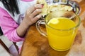 Kid having breakfast with glass of effervescent Vitamin C tablet