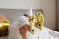 Indoor shot of pretty joyful cute adorable girl kid celebrating eight years old birthday with bright and colorful Royalty Free Stock Photo