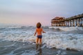 Kid having fun outdoors. Holidays at sea, funny kids, child playing on ocean beach.