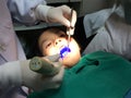 Kid having mouth checkup in dental clinic