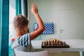 Kid having online chess lesson, e-education, distance learning