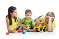 Kid with his parents play building blocks