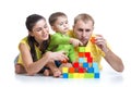 Kid with his parents play building blocks