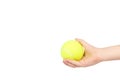 Kid hold tennis ball in hand, isolated on white background. copy space template Royalty Free Stock Photo