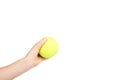 Kid hold tennis ball in hand, isolated on white background. copy space template Royalty Free Stock Photo