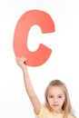 Kid holding alphabet letter
