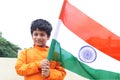 A cute kid holding India flag - Tiranga