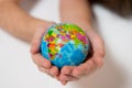 Kid holding little World Globe on her Hands Royalty Free Stock Photo