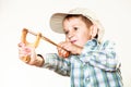 Kid holding slingshot in hands Royalty Free Stock Photo