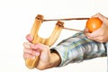 Kid holding slingshot in hands Royalty Free Stock Photo