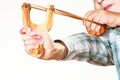 Kid holding slingshot in hands Royalty Free Stock Photo