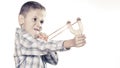 Kid holding slingshot in hands Royalty Free Stock Photo