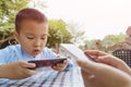 Kid indulge in smartphone