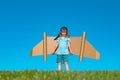 Kid with jet pack superhero. Child pilot against summer sky background. Success, leader and winner concept. Imagination