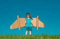 Kid with jet pack superhero. Child pilot against summer sky background. Success, leader and winner concept. Imagination