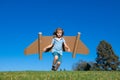 Kid with jet pack superhero. Child pilot against summer sky background. Success, leader and winner concept. Imagination