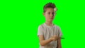 Kid juggles the ping pong ball. Green screen