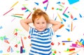 Kid laying among heap of school office supplies Royalty Free Stock Photo