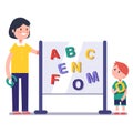 Kid learning abc in kindergarten with teacher